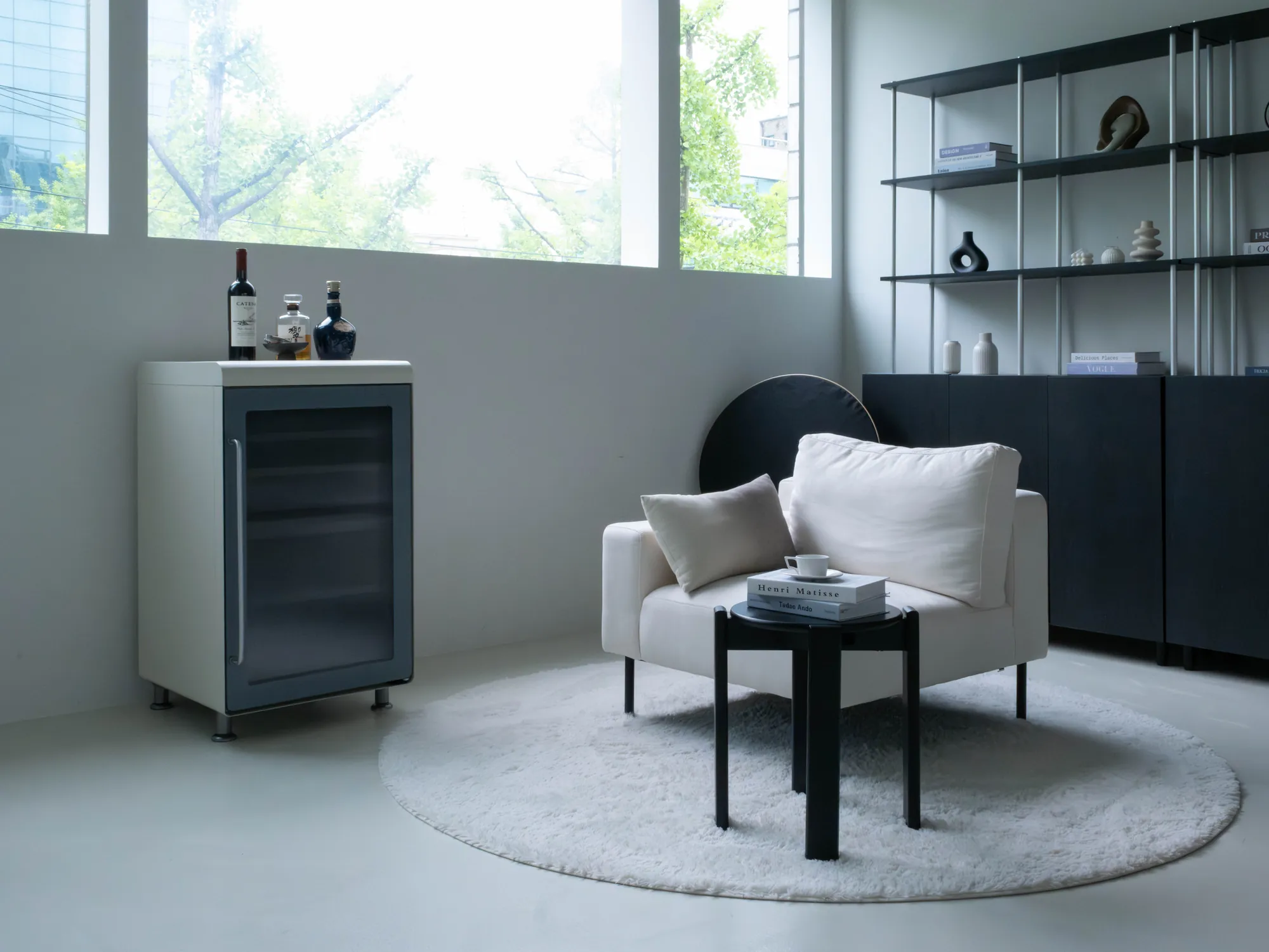 Wine cellar beside a white armchair